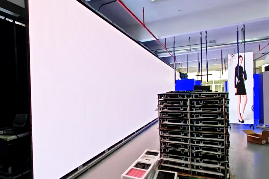 LED wall stage calibration process showing pixel alignment and brightness uniformity testing